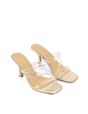 Women's gold metallic strappy mule with stiletto heel and clear vinylite upper
