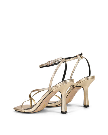 Women's gold leather strappy thong heels with stiletto heel