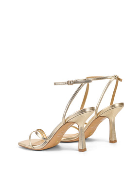 Women's high heel stiletto sandal in gold metallic leather
