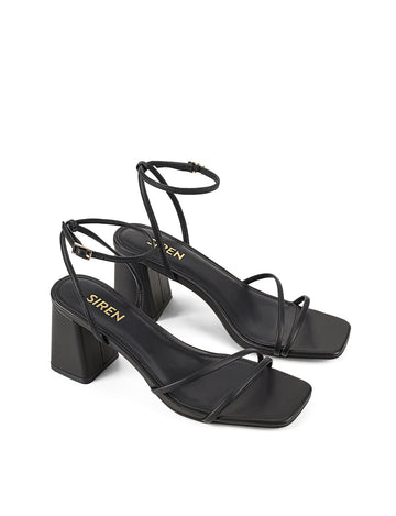 Women's black leather block heel strappy sandal with buckle fastening