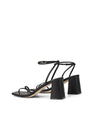 Women's black leather block heel strappy sandal with buckle fastening