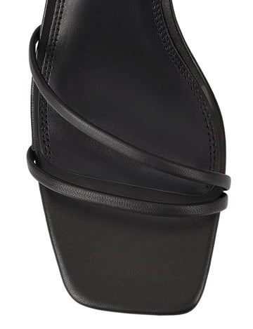 Women's black leather block heel strappy sandal with buckle fastening
