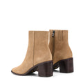 Women's block heel ankle boot with stacked leather heel and almond toe shape in taupe suede