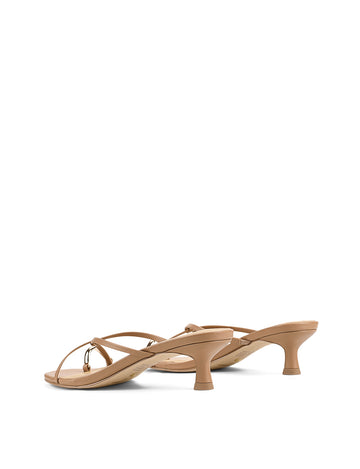 Women's kitten heel strappy sandal with gold metallic toe ring in tan leather
