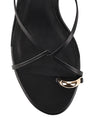 Women's kitten heel strappy sandal with gold metallic toe ring in black leather