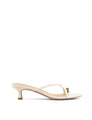 Women's kitten heel strappy sandal with gold metallic toe ring in chalk white leather