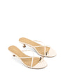 Women's kitten heel strappy sandal with gold metallic toe ring in chalk white leather