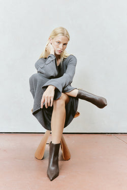 Women's chocolate brown leather ankle boot with high heel and pointed toe