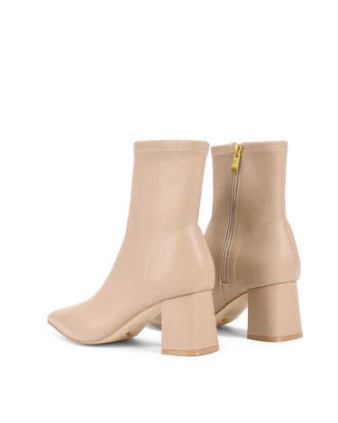 Women's nude stretch leather heeled ankle boot with pointed toe and zip closure
