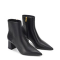 Women's black leather ankle boot with high heel and pointed toe