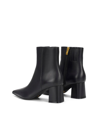 Women's black leather ankle boot with high heel and pointed toe