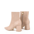 Women's nude leather ankle boot with zip closure, pointed toe and block heel