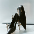 Women's black leather stiletto pumps with pointed toe and v cut throat
